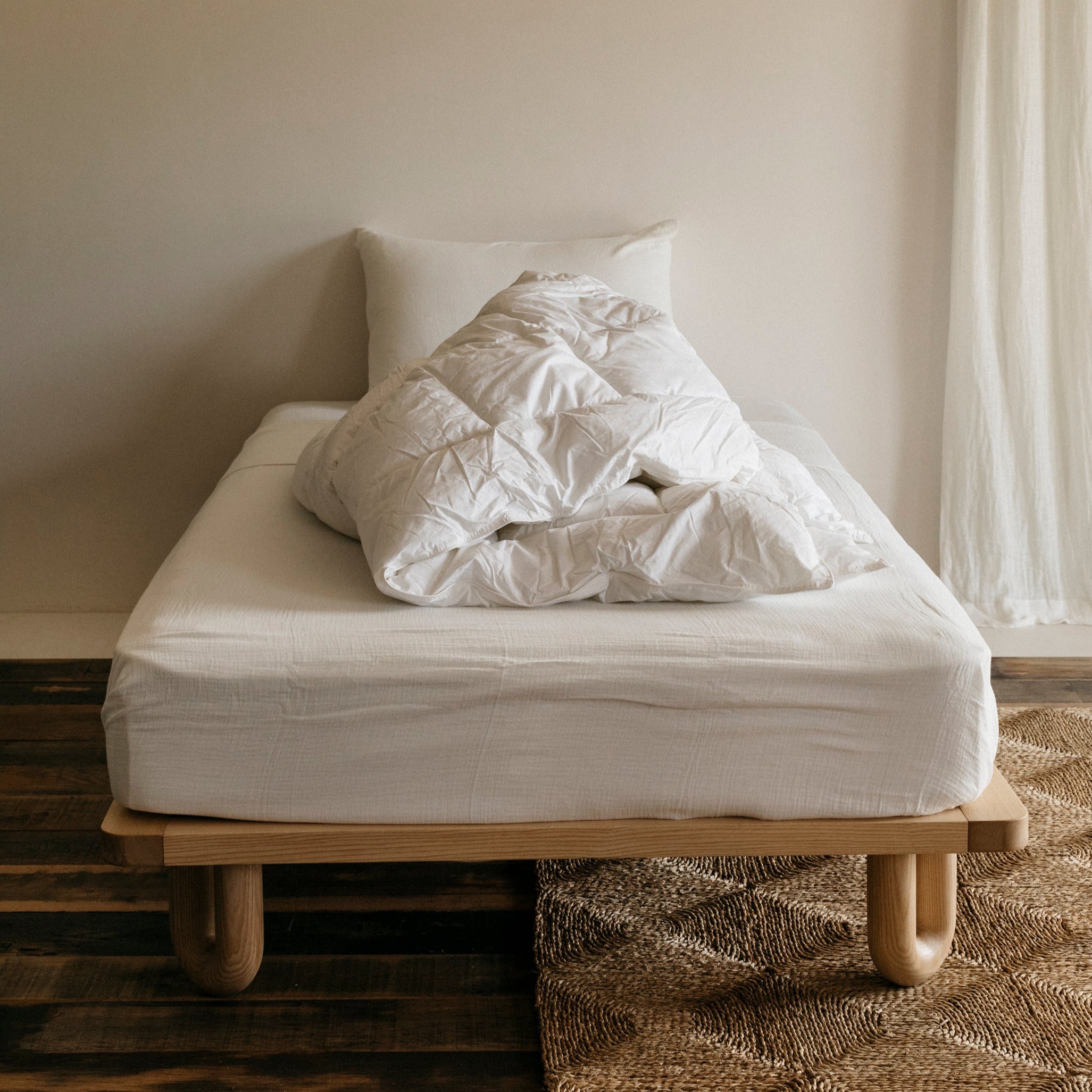 Arche King Single Bed Ashwood in a bedroom with single mattress and unmade white duvet