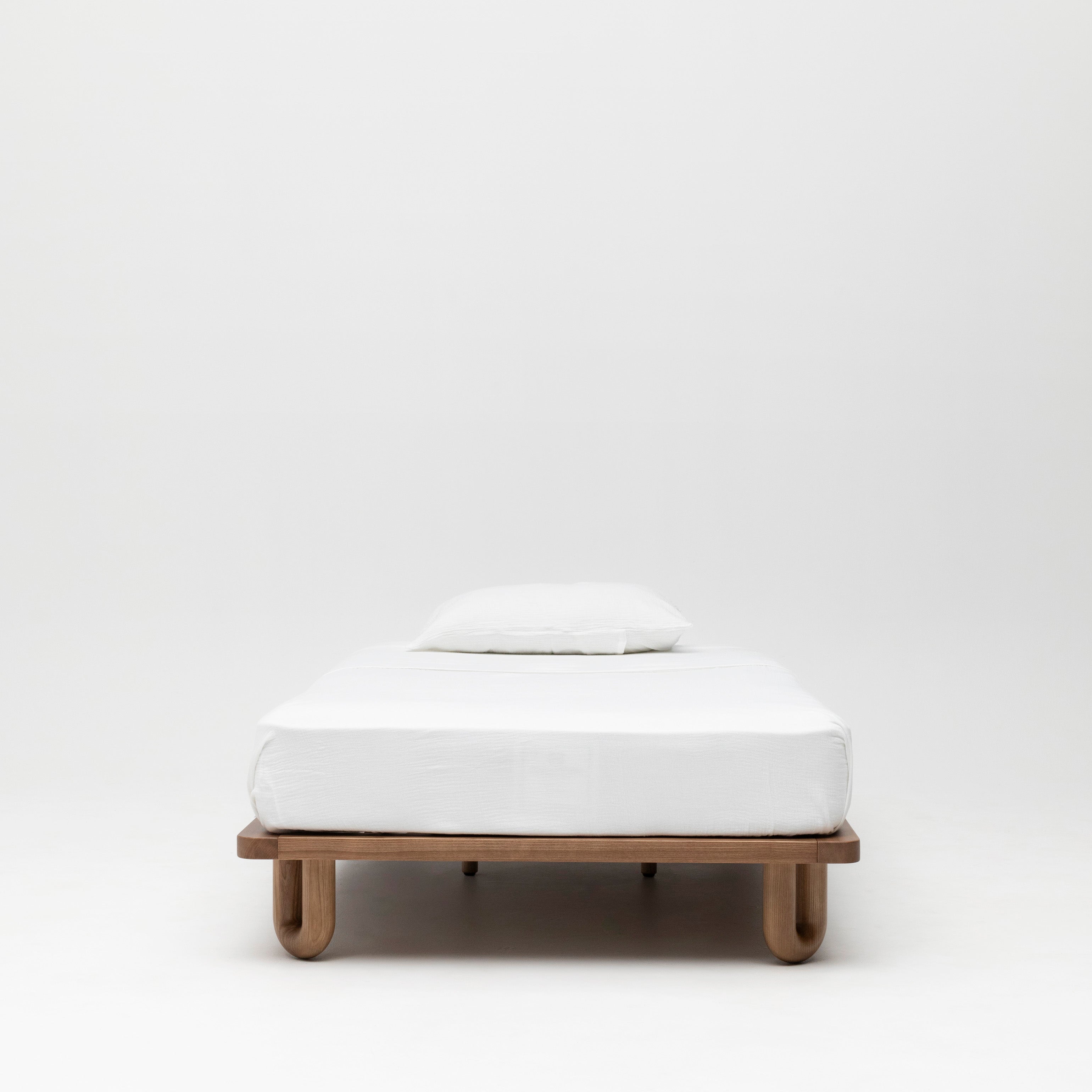 Arche King Single Bed Walnut with single mattress and white linen duvet set