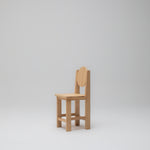 Side angle view of the Hennie Kids Chair in Ashwood timber