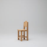 Side angle view of the Hennie Kids Chair in Ashwood timber