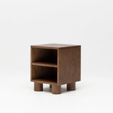Wooden nursery bedside table with two shelves on a white background