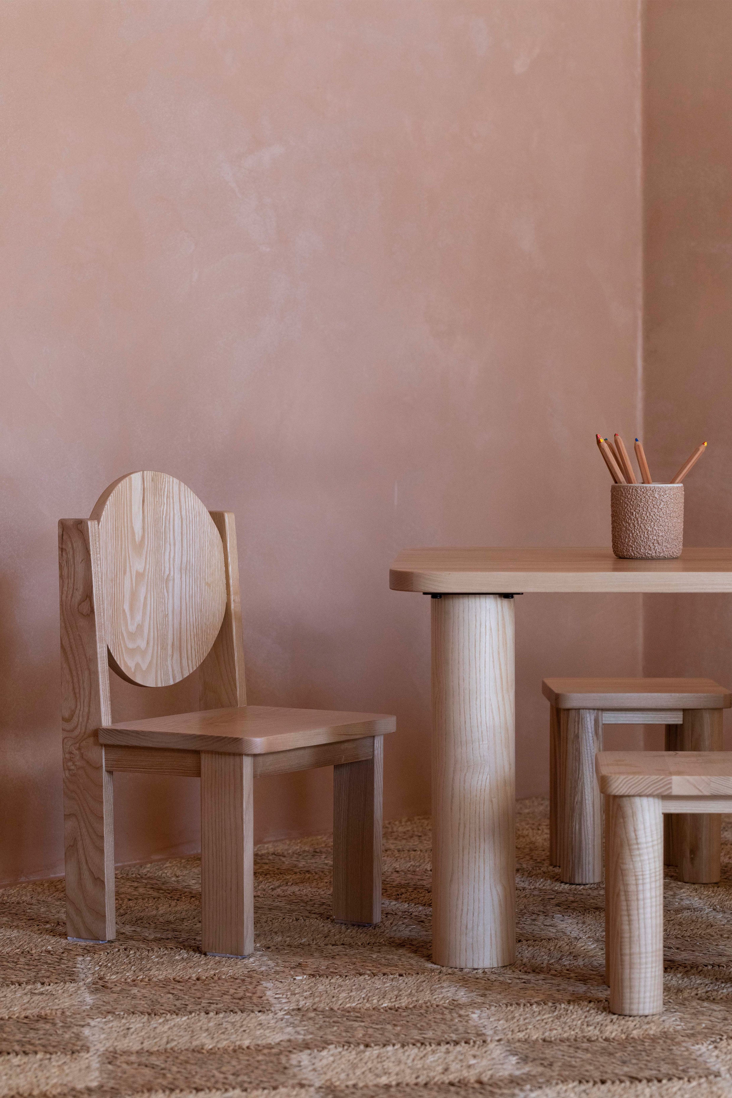 Hennie Ashwood Kids Chair and Activity Play Table Set with pencils in a holder in a kids room