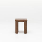 Walnut timber kid's stool with a square top and solid wood legs on a white background