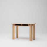 Side angle view of children's study desk in ashwood timber showing paper storage and solid round legs