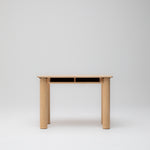 Ecomm image of the Hennie Kids Desk Ashwood  showing homework cubby holes and solid cylinder legs