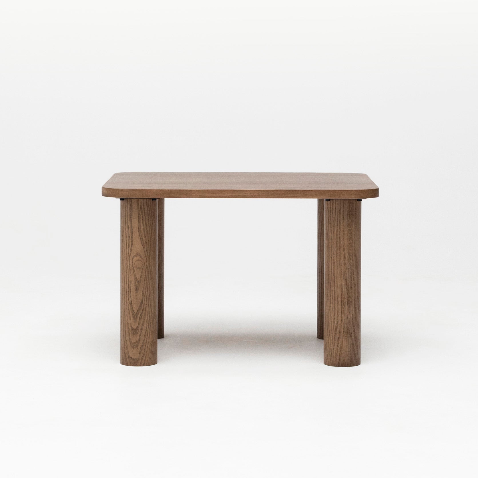 Front ecomm image of the Hennie Walnut Kids Table showing solid wood legs and rounded table top