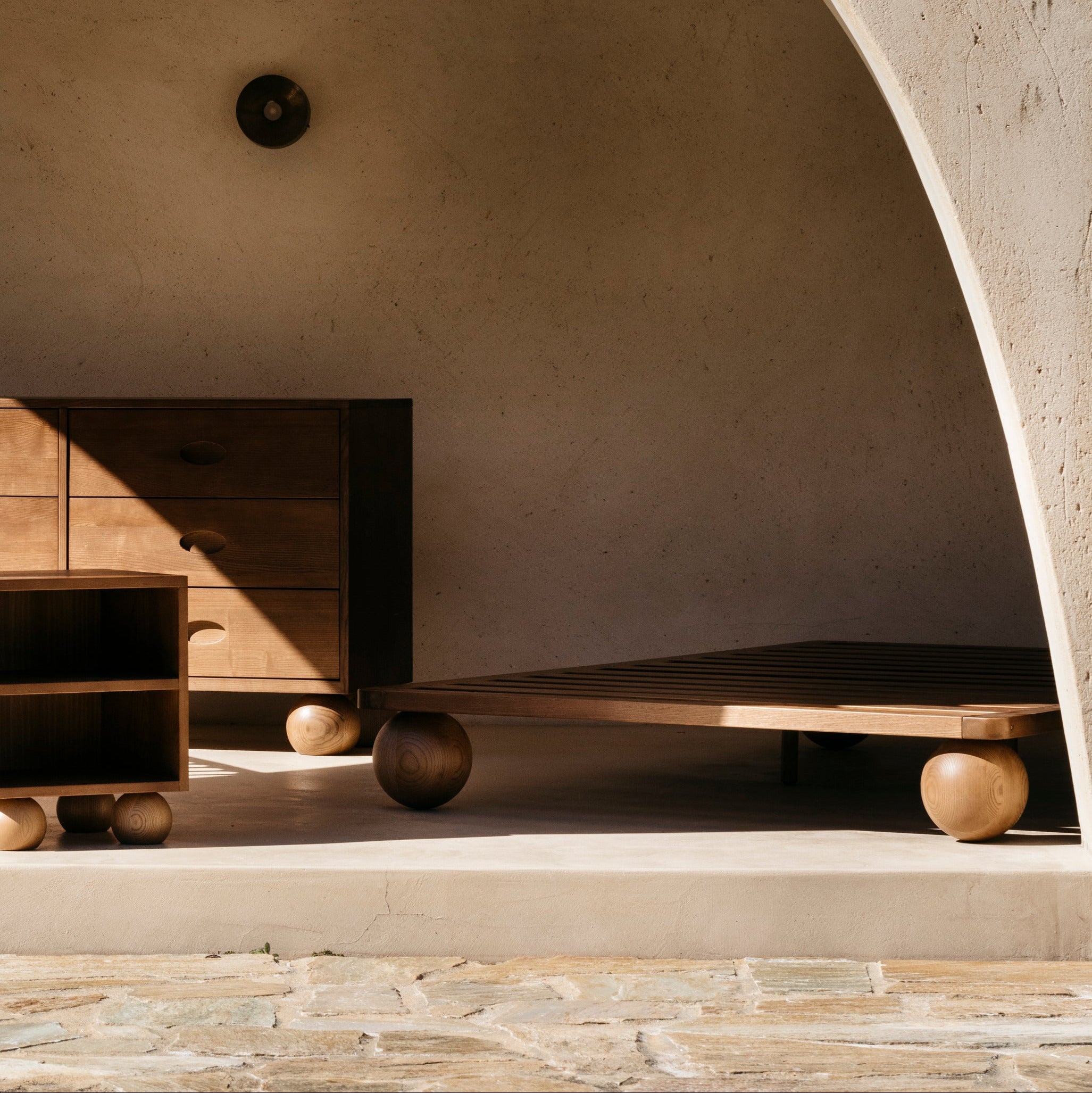 Architectural interior with minimal wooden nursery furniture.