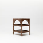 The Yoli Walnut Baby Change Table isolated on a white background showing arched design