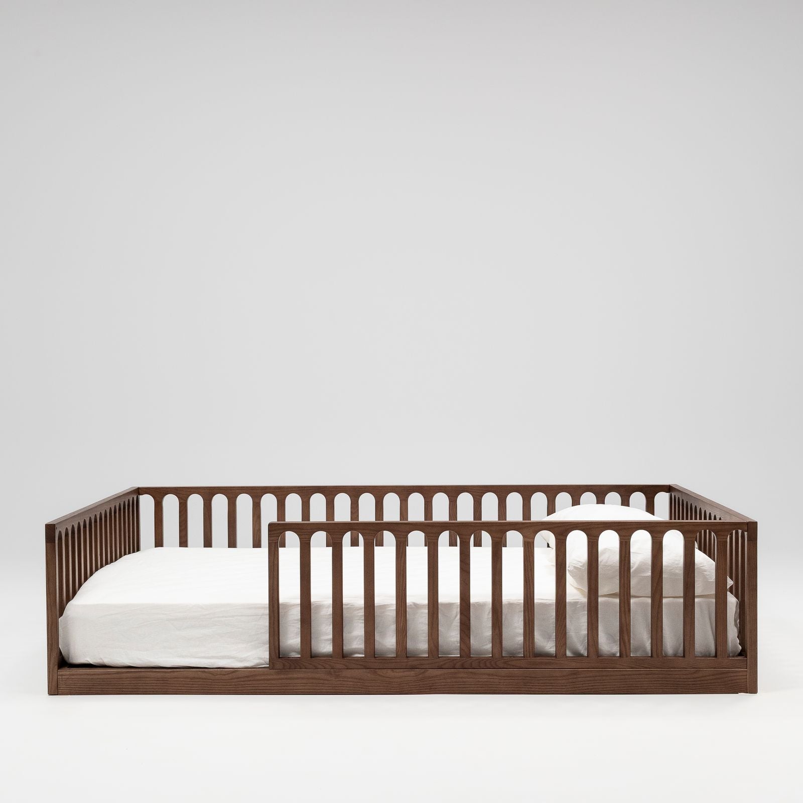 Children's walnut wood floor bed