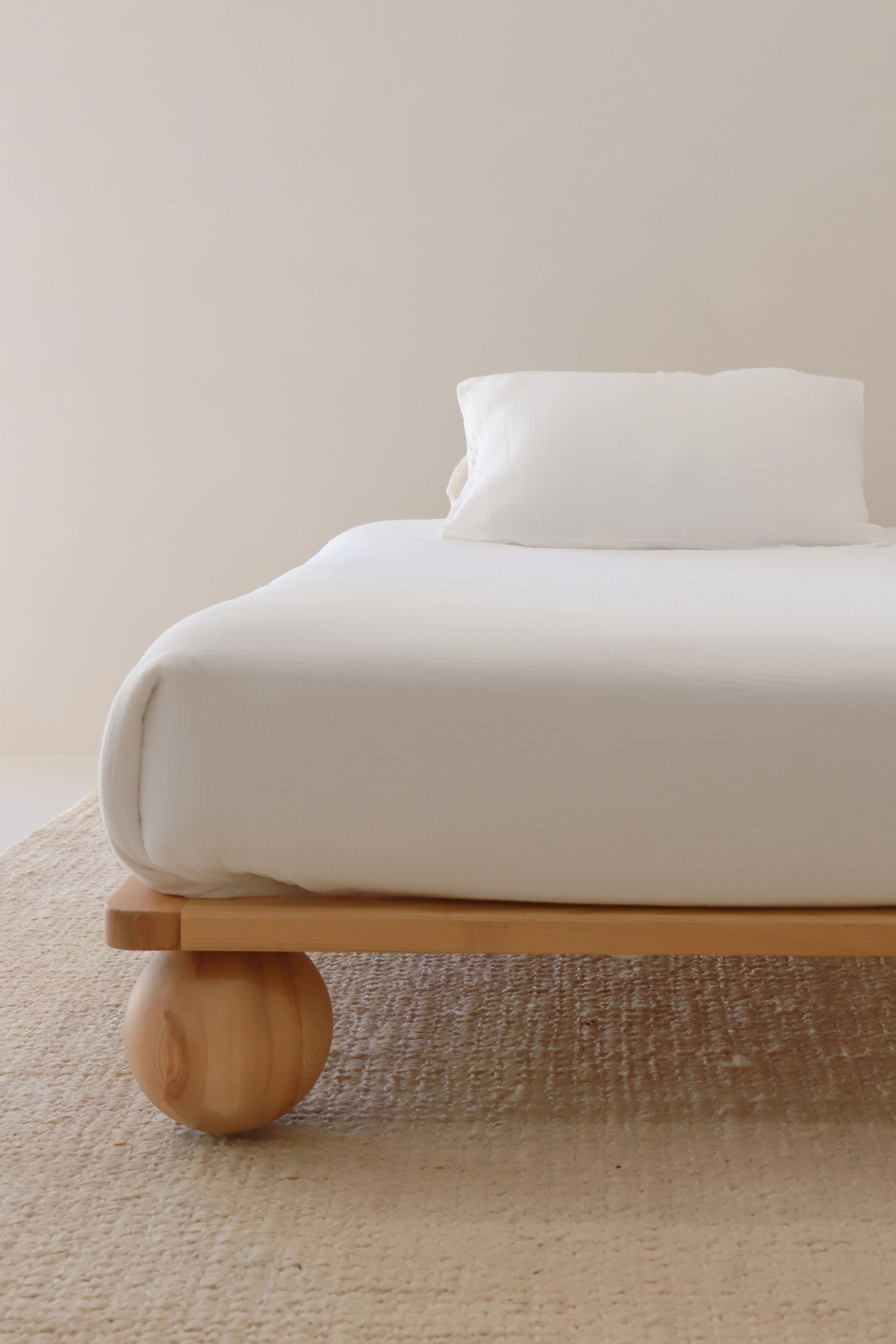 Zali King Single Bed Ashwood in a studio on light background with single mattress and white duvet set