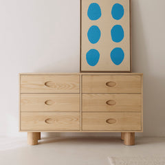 6-Drawer ashwood buffet styled in child's room.