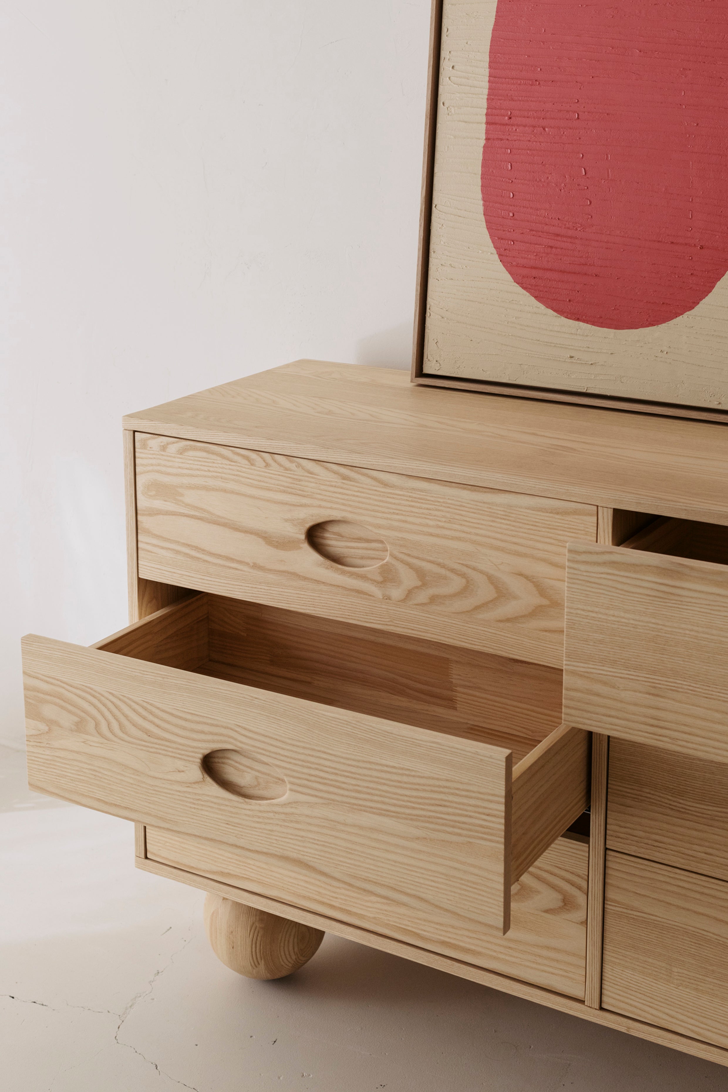 View of an open drawer in the Zali Ashwood Buffet showing deep draw depth and smooth close